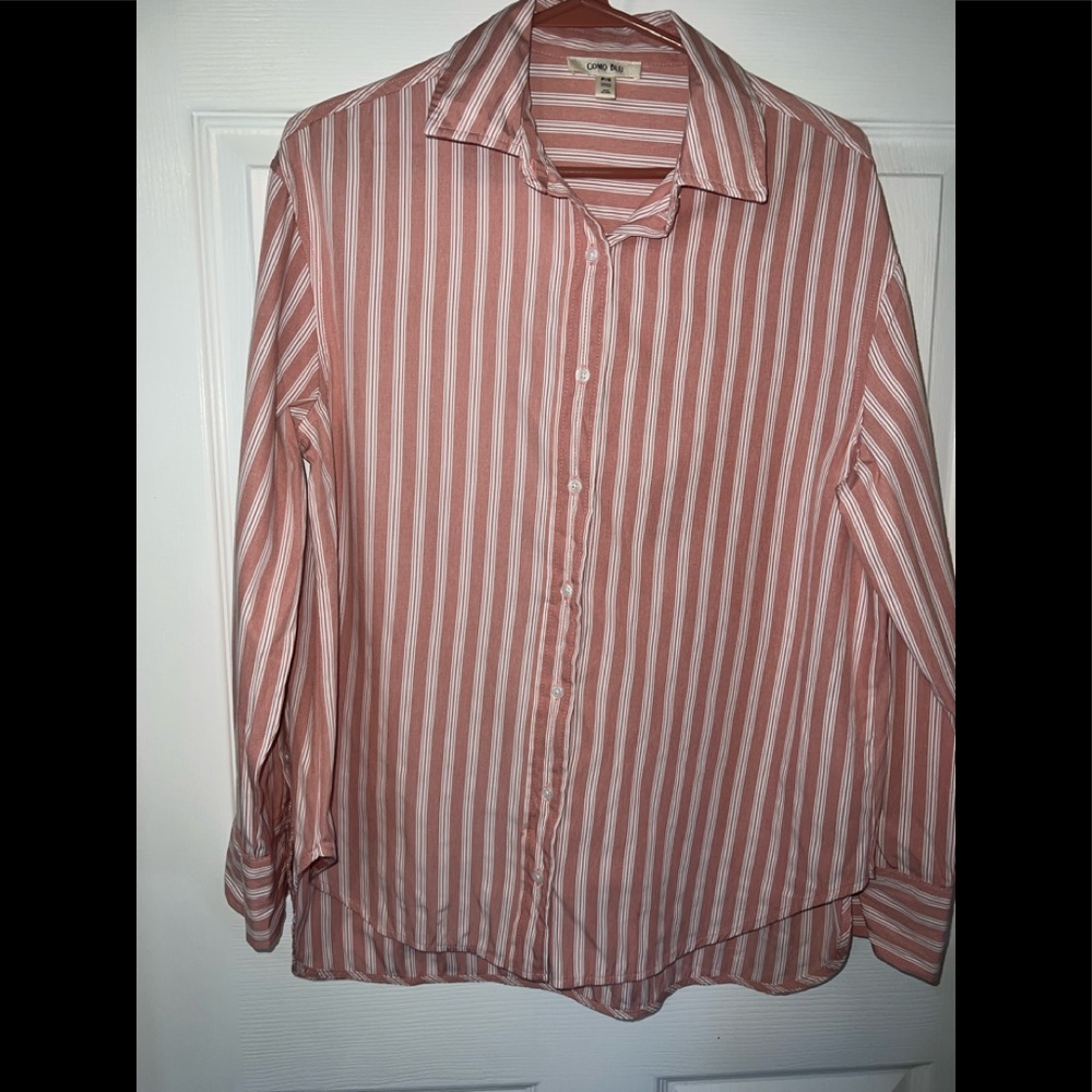 A small button down pink and white women shirt used one time